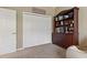 Bedroom features a closet with sliding doors, and a bookcase at 4530 Roanoak Way, Palm Harbor, FL 34685