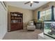 Bright bedroom features a bookcase, comfortable seating and two large fish tanks at 4530 Roanoak Way, Palm Harbor, FL 34685