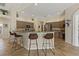 Kitchen with granite countertops, stainless steel appliances, tile floor, and breakfast bar at 4530 Roanoak Way, Palm Harbor, FL 34685