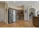 Spacious kitchen features stainless steel refrigerator and tile floor at 4530 Roanoak Way, Palm Harbor, FL 34685