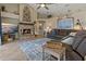 Inviting living room with a stone fireplace, high ceilings, and stylish decor at 4530 Roanoak Way, Palm Harbor, FL 34685