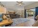 Open-concept living room flowing into dining area and overlooking outdoor pool at 4530 Roanoak Way, Palm Harbor, FL 34685