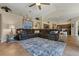 Bright living room features a comfortable sectional sofa and a cozy area rug at 4530 Roanoak Way, Palm Harbor, FL 34685