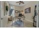 Comfortable home office with a large desk, neutral walls, and lots of natural light at 4530 Roanoak Way, Palm Harbor, FL 34685