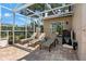 Screened patio with lounge chairs and outdoor seating, providing a relaxing space to enjoy the weather at 4530 Roanoak Way, Palm Harbor, FL 34685