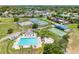 Aerial view of a community center with swimming pool, tennis courts and other recreational facilities at 4813 Glenaire Ct, Tampa, FL 33624