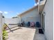 Fenced backyard with a hammock, bicycle, and outdoor seating for relaxation at 4813 Glenaire Ct, Tampa, FL 33624