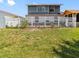 Spacious backyard featuring green grass and a white fence surrounding the perimeter at 4813 Glenaire Ct, Tampa, FL 33624