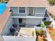 Overhead view of the backyard patio with fenced yard, outdoor seating and garden at 4813 Glenaire Ct, Tampa, FL 33624