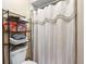 Bathroom featuring a toilet and a shower with a patterned shower curtain at 4813 Glenaire Ct, Tampa, FL 33624