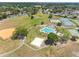 Aerial view of community amenities including baseball field, pool, tennis courts and playground at 4813 Glenaire Ct, Tampa, FL 33624