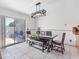 Bright dining area features a table with bench seating and sliding glass doors leading to an outdoor patio at 4813 Glenaire Ct, Tampa, FL 33624