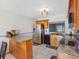 Cozy kitchen features granite countertops, wooden cabinetry, stainless steel appliances, and tiled floors at 4813 Glenaire Ct, Tampa, FL 33624