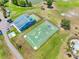 Aerial view of colorful Kid Kourts playground including a basketball court and shaded play area at 4813 Glenaire Ct, Tampa, FL 33624