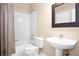 Well-lit bathroom with shower/tub combo, updated vanity, and decorative mirror at 5205 Fairway One Dr, Valrico, FL 33596