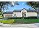 Home with lawn and foundation planting and attached two car garage at 5205 Fairway One Dr, Valrico, FL 33596