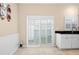 Bright breakfast nook with tile floor and backyard access via sliding doors with plantation shutters at 5205 Fairway One Dr, Valrico, FL 33596