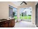 The screened lanai contains a sink and barbeque grill at 5205 Fairway One Dr, Valrico, FL 33596