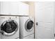 Convenient laundry room with updated appliances and ample cabinet space at 5205 Fairway One Dr, Valrico, FL 33596