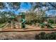 Community playground with slides and climbing structures for recreation at 5205 Fairway One Dr, Valrico, FL 33596