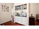 Mirrored wet bar area complete with granite countertops and ample cabinet space at 5205 Fairway One Dr, Valrico, FL 33596