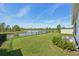 Enjoy a beautiful backyard with a serene lake view and fenced yard at 5411 Thistle Field Ct, Wesley Chapel, FL 33545