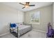 Bedroom with a window and a bed at 5411 Thistle Field Ct, Wesley Chapel, FL 33545