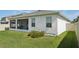 A home exterior shows the well-maintained yard with a fenced backyard at 5411 Thistle Field Ct, Wesley Chapel, FL 33545