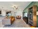Inviting living room with modern decor, a spacious layout, and easy access to the kitchen at 5411 Thistle Field Ct, Wesley Chapel, FL 33545