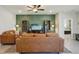 Comfortable living room featuring a statement wall, plush sofas, and plenty of natural light at 5411 Thistle Field Ct, Wesley Chapel, FL 33545