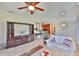 Cozy living room with tile flooring, ceiling fan, and view to dining area at 5532 Sunset Falls Dr, Apollo Beach, FL 33572