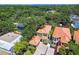 Aerial view of homes in a neighborhood with terracotta roofs, lush landscaping, and beautiful architecture at 6008 Interbay Blvd, Tampa, FL 33611