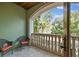 Outdoor balcony showcasing a decorative stone balustrade and inviting seating with lush, natural views at 6008 Interbay Blvd, Tampa, FL 33611