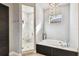 Serene bathroom features a standalone tub, marble shower, and modern lighting for a spa-like experience at 6008 Interbay Blvd, Tampa, FL 33611