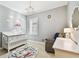 Adorable Bedroom with a crib, chair, and airplane-themed decor at 6008 Interbay Blvd, Tampa, FL 33611