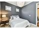 Comfortable bedroom featuring plush bedding, side table, and stylish overhead lighting at 6008 Interbay Blvd, Tampa, FL 33611