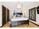 This bedroom has a large bed, shuttered windows and built-in wardrobe with lots of space at 6008 Interbay Blvd, Tampa, FL 33611
