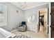 Charming Bedroom features gray walls, a crib, and a glider chair at 6008 Interbay Blvd, Tampa, FL 33611