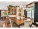 Charming dining room featuring a wooden table, wood floors, and a unique pendant light fixture at 6008 Interbay Blvd, Tampa, FL 33611