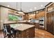 Spacious kitchen features custom cabinetry, granite countertops, and stainless steel appliances at 6008 Interbay Blvd, Tampa, FL 33611