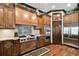 Kitchen featuring custom cabinetry, stainless steel appliances, and a built-in oven at 6008 Interbay Blvd, Tampa, FL 33611