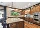 Beautiful kitchen with custom cabinets, granite countertops, and stainless steel appliances at 6008 Interbay Blvd, Tampa, FL 33611
