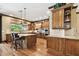 Gourmet kitchen with custom cabinetry, large island, granite countertops and stainless steel appliances at 6008 Interbay Blvd, Tampa, FL 33611