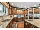 Open-concept kitchen with stainless steel appliances, granite counters and lots of counter space at 6008 Interbay Blvd, Tampa, FL 33611