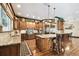 Chef's kitchen featuring custom cabinetry, granite countertops, and a functional center island at 6008 Interbay Blvd, Tampa, FL 33611