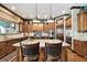 Gourmet kitchen featuring stainless steel appliances, granite countertops, and a functional center island at 6008 Interbay Blvd, Tampa, FL 33611