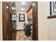 Laundry room with front loading washer and dryer, brown cabinets and tile floor at 6008 Interbay Blvd, Tampa, FL 33611