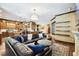 Open-concept living room connects to the gourmet kitchen and showcases hardwood floors at 6008 Interbay Blvd, Tampa, FL 33611