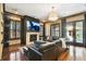 Elegant living room boasts a fireplace, hardwood floors and ample seating for entertaining at 6008 Interbay Blvd, Tampa, FL 33611