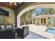 An outdoor patio featuring comfortable seating near the pool, perfect for relaxing and entertaining guests at 6008 Interbay Blvd, Tampa, FL 33611
